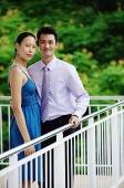 Couple standing together, side by side, looking at camera - Asia Images Group