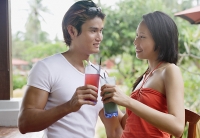 Couple toasting with drinks - Asia Images Group
