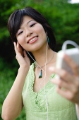 Young woman with mp3 player - Asia Images Group