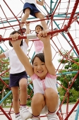 Four girls at playground, climbing on jungle gym - Asia Images Group