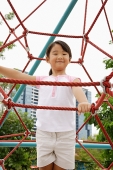 Girl on jungle gym - Asia Images Group