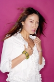 Young woman in white lace blouse, looking at camera - Asia Images Group
