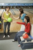 Three women in bowling alley - Asia Images Group