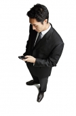 Businessman with mobile phone - Asia Images Group