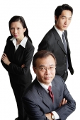 Executives looking at camera, serious expressions - Asia Images Group