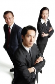 Executives looking at camera, serious expressions - Asia Images Group