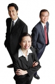 Two businessman and one businesswoman standing, smiling at camera - Asia Images Group