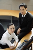 Executives in office cubicle, looking at camera - Asia Images Group