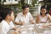 Family playing cards - Asia Images Group