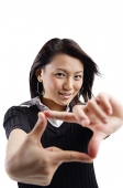 Young woman making hand sign - Asia Images Group