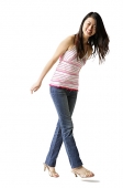 Woman in striped top and jeans, smiling at camera - Asia Images Group