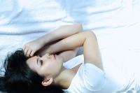 Young woman lying on side - Asia Images Group
