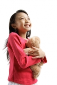 Girl hugging teddy bear - Asia Images Group