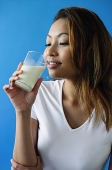 Woman drinking a glass of milk - Asia Images Group