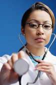 Doctor using stethoscope - Asia Images Group