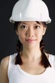 Young woman wearing hard hat - Asia Images Group