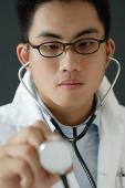 Doctor using stethoscope - Asia Images Group