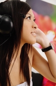 Girl listening to headphones, side view - Asia Images Group