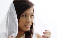 Young woman wearing veil, head shot - Asia Images Group