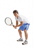 Young man holding tennis racket - Asia Images Group