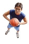 Young man holding basketball - Asia Images Group