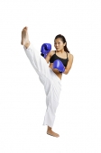 Female boxer with one leg raised - Asia Images Group