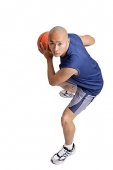 Young man holding basketball - Asia Images Group