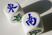 Still life of Chinese dice with the words 'East' and 'South' - Asia Images Group