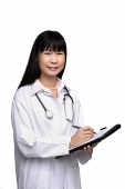 Doctor with medical chart, smiling at camera - Asia Images Group