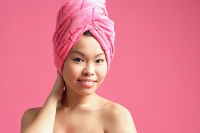 Woman wearing pink towel turban - Asia Images Group