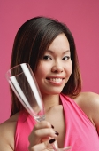 Woman holding champagne glass - Asia Images Group