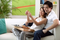 Couple at home in living room - Asia Images Group