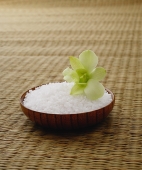 Single flower on bowl of rice - Asia Images Group