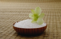 Bowl of rice with a flower, on a tatami mat - Asia Images Group