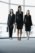 Three businesswomen, walking towards camera - Asia Images Group