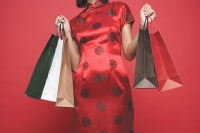 Woman carrying shopping bags, cropped image - Asia Images Group