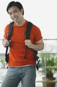 Man in red T shirt and jeans - Asia Images Group