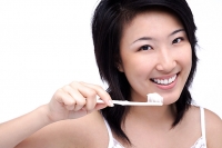Young woman with toothbrush - Asia Images Group