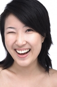 Young woman winking - Asia Images Group