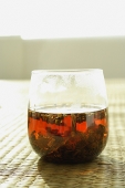 Glass of Chinese Tea on woven mat - Asia Images Group