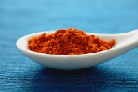 Close-up of spoon with chili powder - Asia Images Group