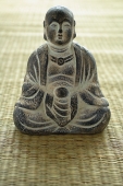 Still life of with small Buddha sculpture - Asia Images Group
