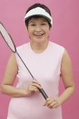 Mature woman with badminton racket - Asia Images Group