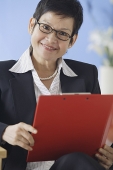 Business woman holding clipboard - Asia Images Group