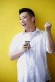 Man listening to MP3 Player - Asia Images Group