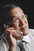 Senior man using mobile phone - Asia Images Group