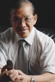 Senior businessman holding mobile phone - Asia Images Group