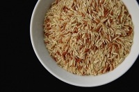 Still life, uncooked rice in a bowl - Asia Images Group