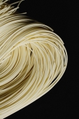 Chinese noodles against black background, close up - Asia Images Group