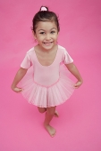 Young girl in ballet outfit, smiling at camera - Asia Images Group